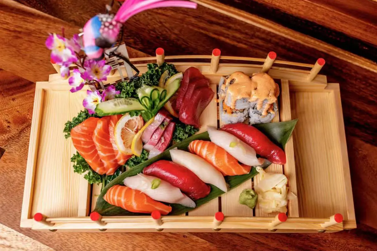 Fresh sushi and sashimi platter featuring assorted nigiri, maki rolls, and premium sliced raw fish with wasabi and ginger at Kyushu Sushi & Ramen，a Asian Restaurant in Fairfield